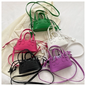 Top view of mini bucket bags in multiple colors with drawstring liners and fashion embossing