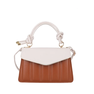 Chic two-tone crossbody bag in cream and caramel with quilted stripes and knotted handle