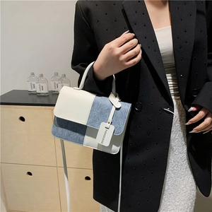 Minimalist rectangular crossbody bag in blue and white patchwork with top handle