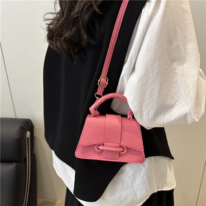 Pink lychee grain leather mini crossbody bag with top handle and chain shoulder strap