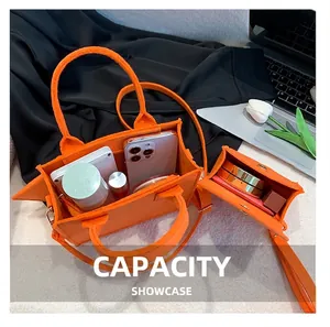 Detail showing internal storage capacity of the orange felt tote bag set with daily essentials