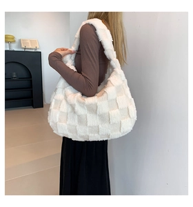Detailed shot of large plush checkered tote bag for women in soft white and beige
