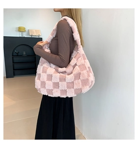 Detailed close-up of pink and beige checkered plush tote bag with soft faux fur texture
