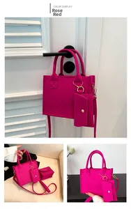 Detail of rose red quilted felt tote bag set with mini pouch and golden hardware