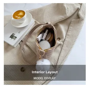 Interior view of beige corduroy crossbody bag showing lipstick and cushion storage