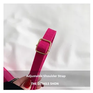 Adjustable hot pink felt shoulder strap with gold metal buckle detail showing texture