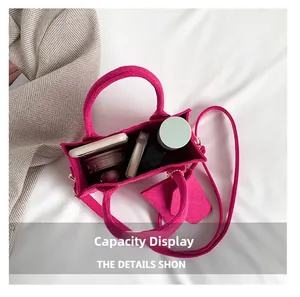 Top view showing large capacity of fuchsia felt tote bag with shoulder strap and pouch