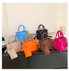 Quilted felt tote bags in six vibrant colors with matching detachable pouch detail