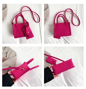 Detail view of fuchsia felt tote bag set with geometric embossing and small purse