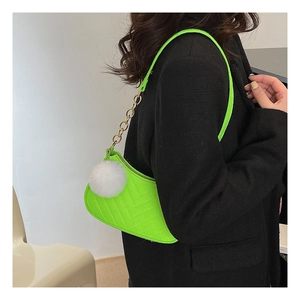 Neon green V-quilted shoulder bag with gold chain and white pompom detail