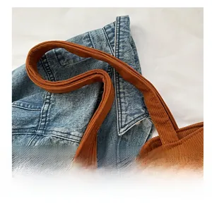 Detail view of reinforced corduroy tote bag wide handle and stitch craftsmanship