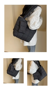 Détails du sac cabas matelassé noir avec motifs hexagonaux et sa petite pochette assortie