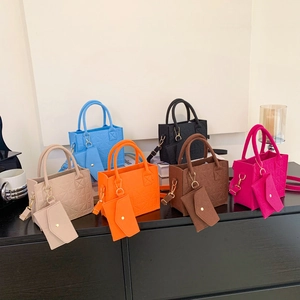 Minimalist felt tote bag set in six colors with quilted geometric pattern and round handles