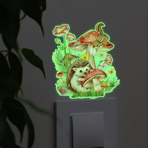 Close-up of luminous hedgehog and mushroom wall stickers glowing in a dark room setting
