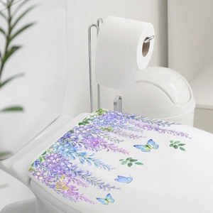 Watercolor vine and butterfly wall sticker applied on a white toilet lid cover