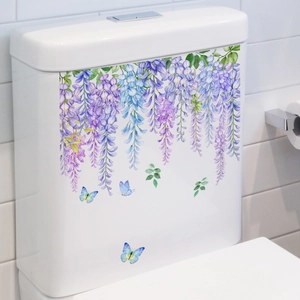 Self-adhesive purple floral vine and blue butterfly wall stickers on a white toilet tank
