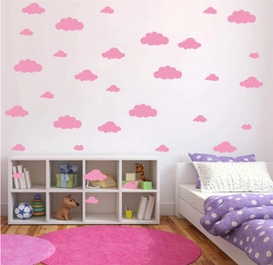 Pink cloud wall stickers for kids bedroom decor applied on walls and white cabinets