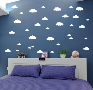 White cloud wall stickers for kids bedroom decor shown on a dark blue background wall