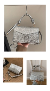 Detailed view of silver metallic crossbody bag featuring unique textured knot handle