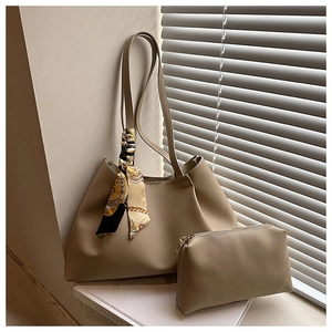 Detail of khaki tote bag set with patterned handle scarf and matching small pouch