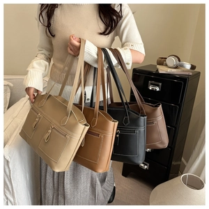 Detail showing soft PU leather texture and contrast stitching on the large tote bag