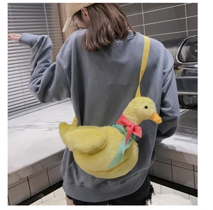 Cute yellow plush duck crossbody bag with red and green bow and fabric shoulder strap