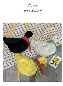 Trio of plush duck crossbody bags in black, white, and yellow with cute polka dot scarves