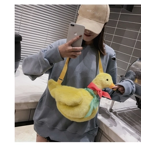 Cute yellow plush duck crossbody bag with a colorful bow and adjustable strap