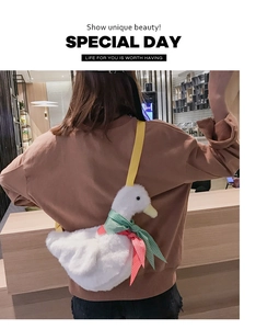 Back view of model wearing a cute plush duck shoulder bag with colorful scarf and yellow strap