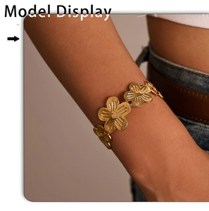 Detailed view of a gold flower bracelet featuring hollowed five-petal floral patterns
