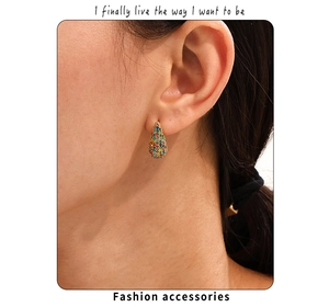 Close-up of 18K gold plated teardrop earrings with multi-color cubic zirconia stones