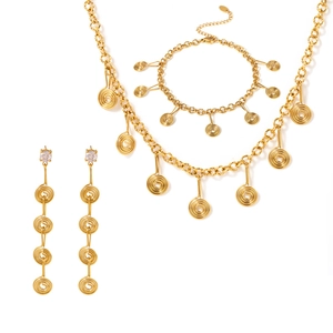 Gold spiral coil jewelry set with necklace bracelet and long drop tassel earrings