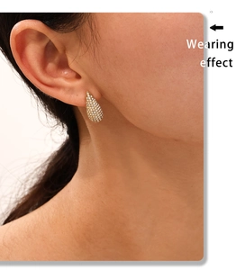Wearing effect of teardrop stud earrings with gold plating and paved pavé zircon stones