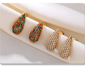 Macro shot of 18K gold plated teardrop earrings with multi-colored and white zircons