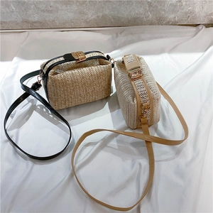Detail of woven straw handbag featuring fine textures, metal lock, and leather strap