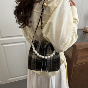 Vintage checkered drawstring bucket bag with pearl handle and golden ball chain strap