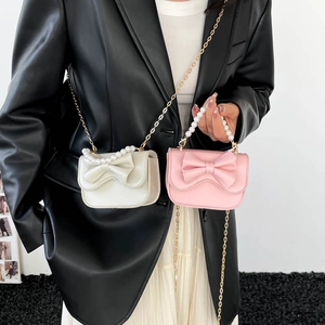 Chic mini bow shoulder bag with pearl handle and gold chain strap for women