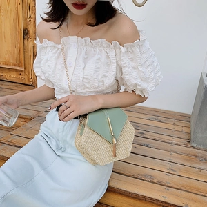 Chic hexagonal straw crossbody bag with green leather flap and gold tassel chain