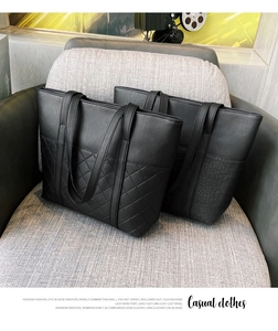 Detail of black tote bags showing classic diamond quilted and crocodile embossed textures