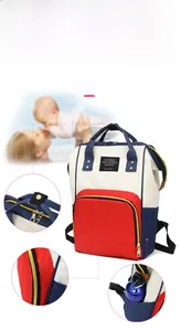 Detail of red white and blue diaper bag showing side water bottle pocket and metal zipper