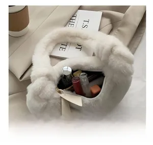 Close-up of the plush white handbag interior showing capacity for lipstick and perfume