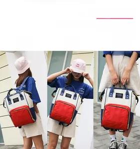 Detail view of the multi-functional diaper backpack in hand-held and shoulder-carried modes