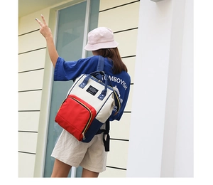 Detailed view of the tricolor multi-functional diaper bag in red white and blue canvas