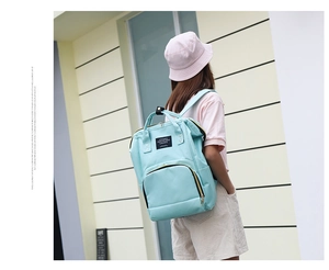 Detail of mint green waterproof nylon backpack with large capacity and doctor bag opening