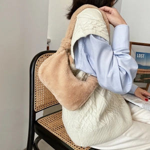 Faux fur beige underarm bag with knot handle and shoulder strap for autumn fashion