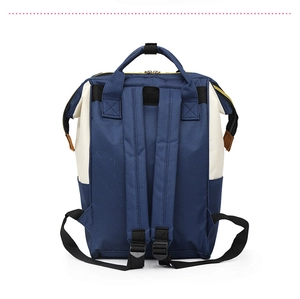 Detail view of reinforced padded shoulder straps on a navy and cream large diaper backpack