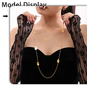 Long gold necklace with white shell pendants shown on model in vintage fashion style