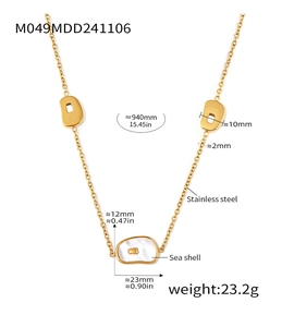 Detail of long gold stainless steel necklace with natural sea shell horseshoe pendants