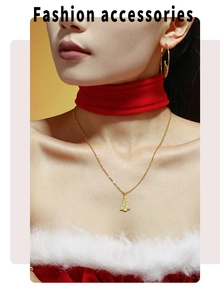 Close-up of golden Christmas tree pendant necklace with zircons on model with hoop earrings