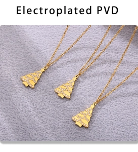 Detail of Christmas tree pendant necklace with PVD gold plating and white zirconia